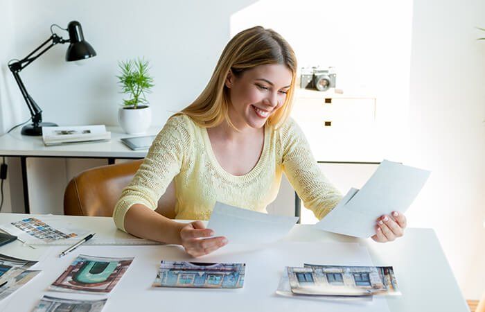 Girl holding photo prints