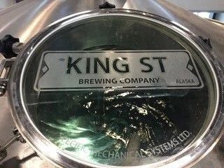 KING ST Brewing Company logo on a reflective metal surface
