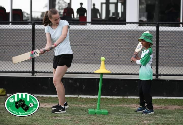 Woolworths Cricket Blast session at Morton Park. A parent helping to coach a junior Blaster.