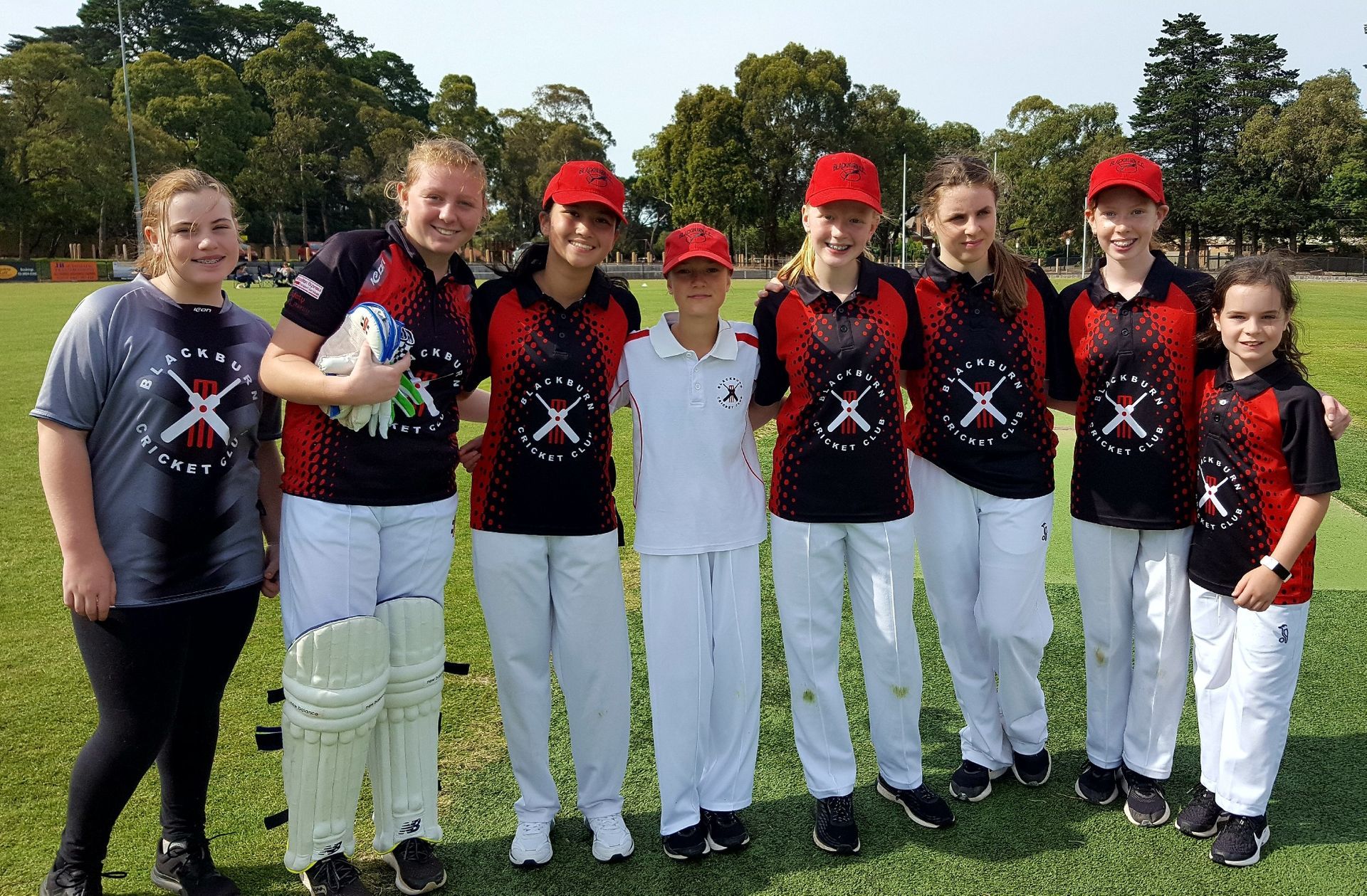 BCC junior girls team posing for a photo after a match.