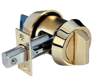 A close up of a brass door lock on a white background