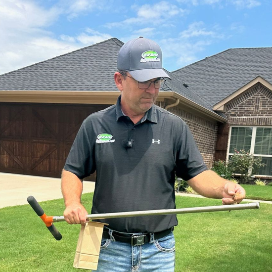 Aaron Shehan working in front of a North Texas Home