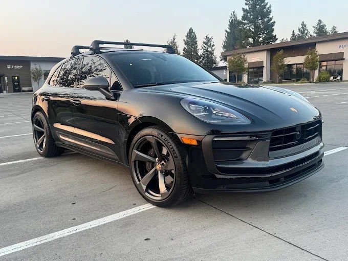 Black Porsche Macan SUV with a deep gloss finish after ceramic coating in Redmond, OR
