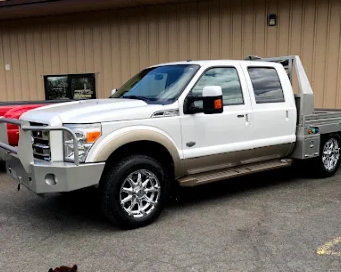White Ford flatbed truck with ceramic coating, detailed by Perfection Plus Auto Salon