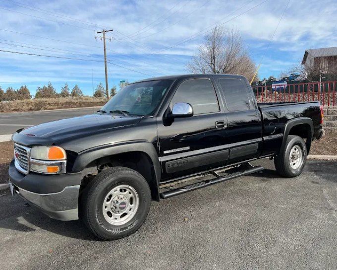 Black GMC Sierra truck with window tint darkness options available at Perfection Plus Auto Salon