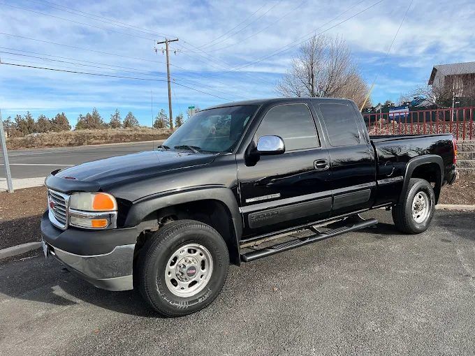 Black GMC Sierra pickup truck featuring professional window tinting in Redmond, OR
