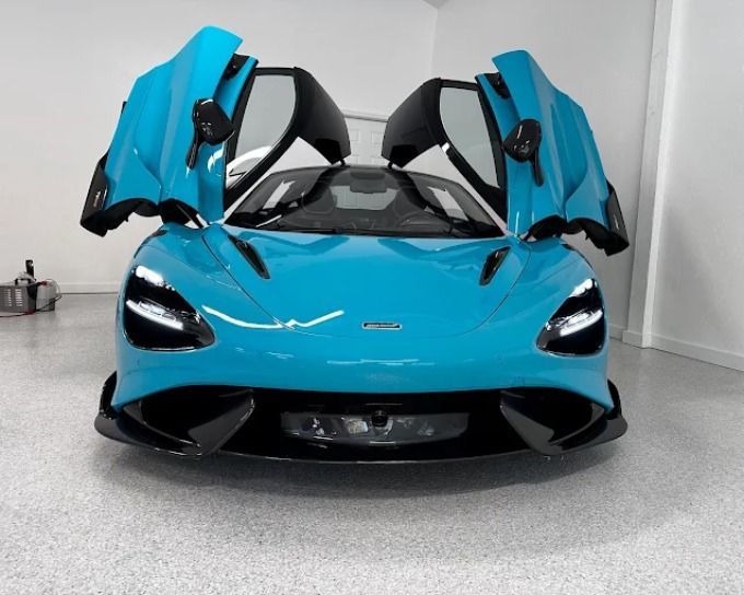 Teal McLaren with PPF coverage on front end, showroom detail by Perfection Plus Auto Salon