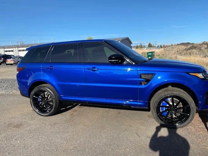 Blue Range Rover Sport SUV with privacy window tinting in Redmond, OR