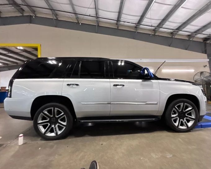 Silver Cadillac Escalade SUV guarded against rock chips with PPF installation