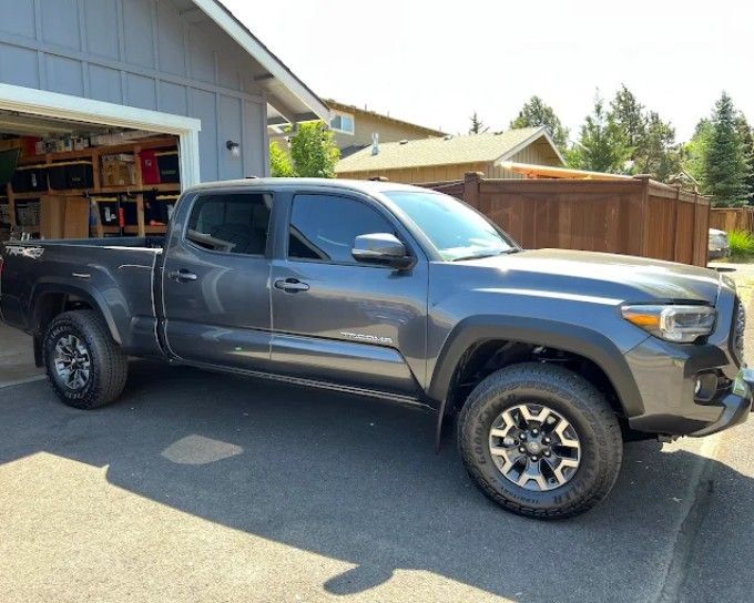Gray Toyota Tacoma with ceramic coating, parked outside garage