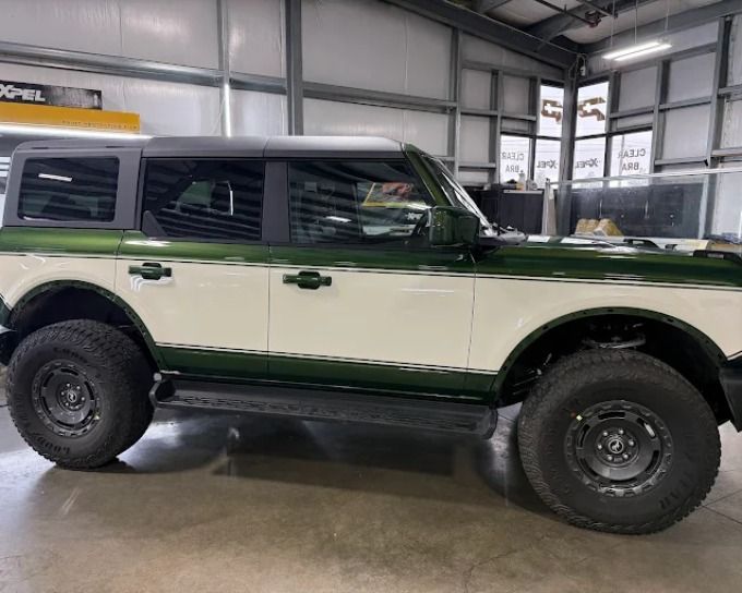 Two-tone green and white Ford Bronco with expert window tint installation