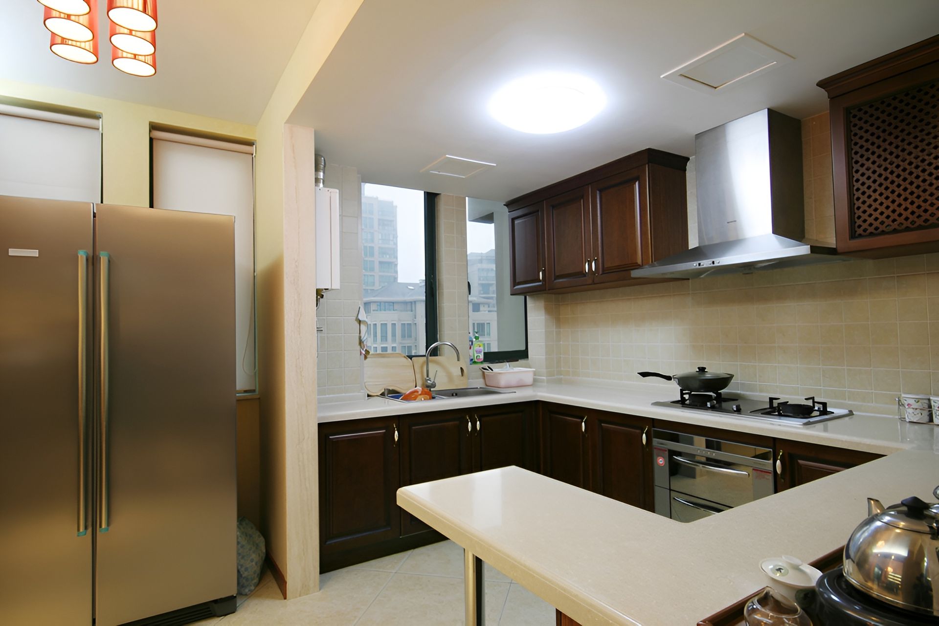 A Kitchen With Stainless Steel Appliances and Wooden Cabinets — Precision Kitchens & Cabinets in Lismore, NSW