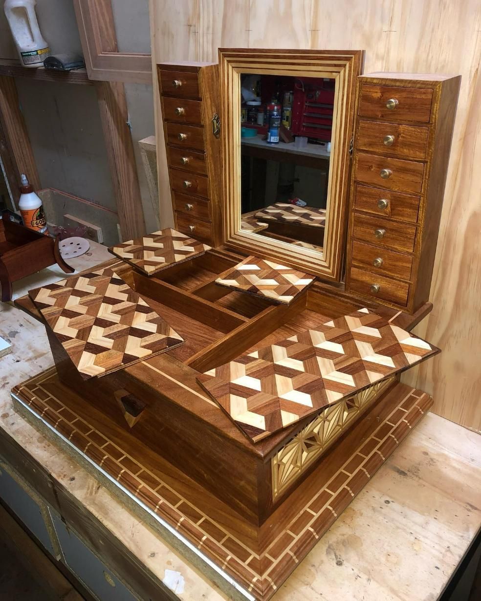 A Wooden Jewelry Box With Drawers and a Mirror is Sitting on a Wooden Table — Precision Kitchens & Cabinets in Ballina, NSW