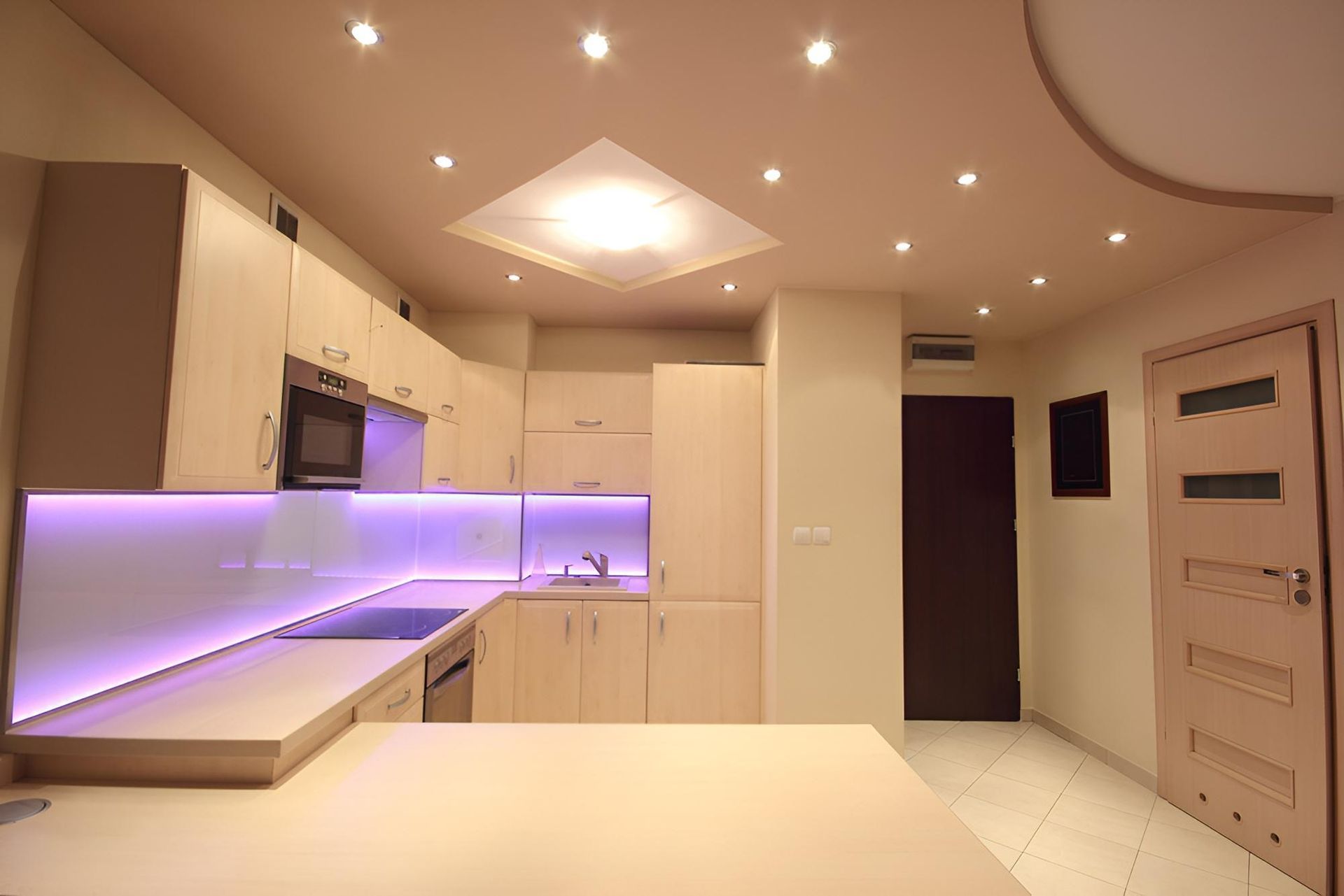 A Kitchen With Purple Lights on the Walls and Ceiling — Precision Kitchens & Cabinets in Evans Head, NSW
