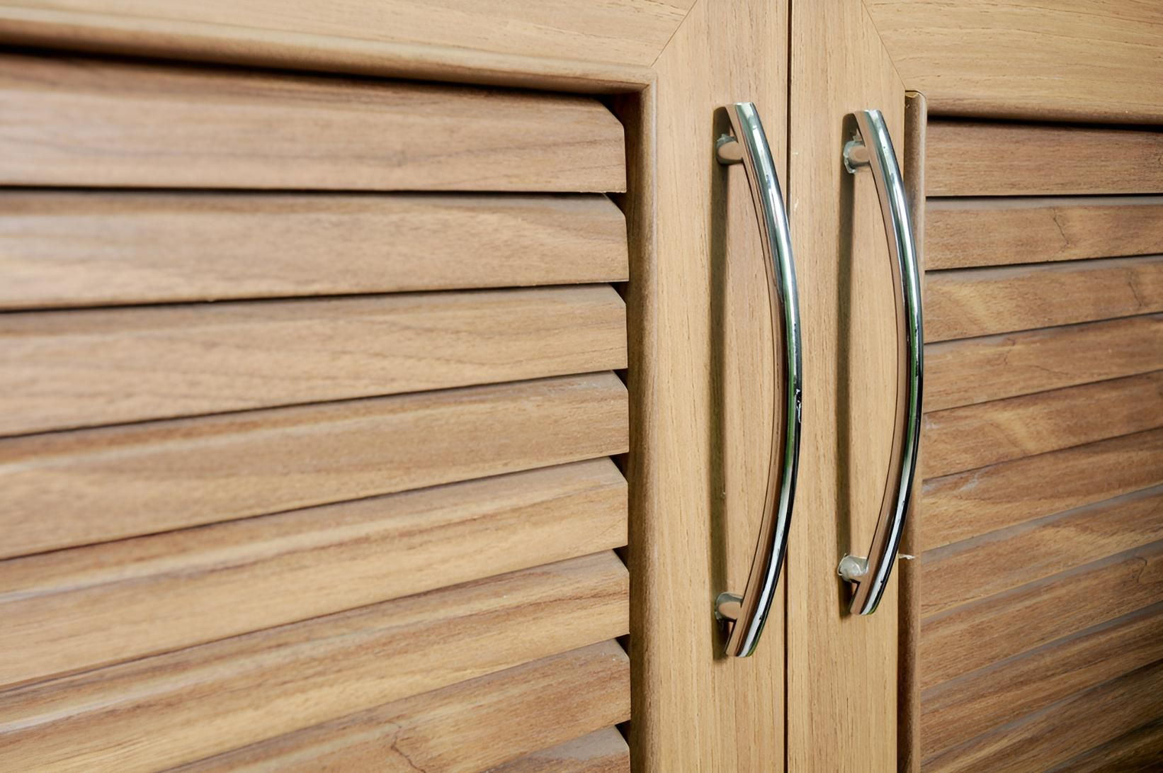 A Close Up of a Wooden Cabinet With Metal Handles — Precision Kitchens & Cabinets in Lennox Head, NSW