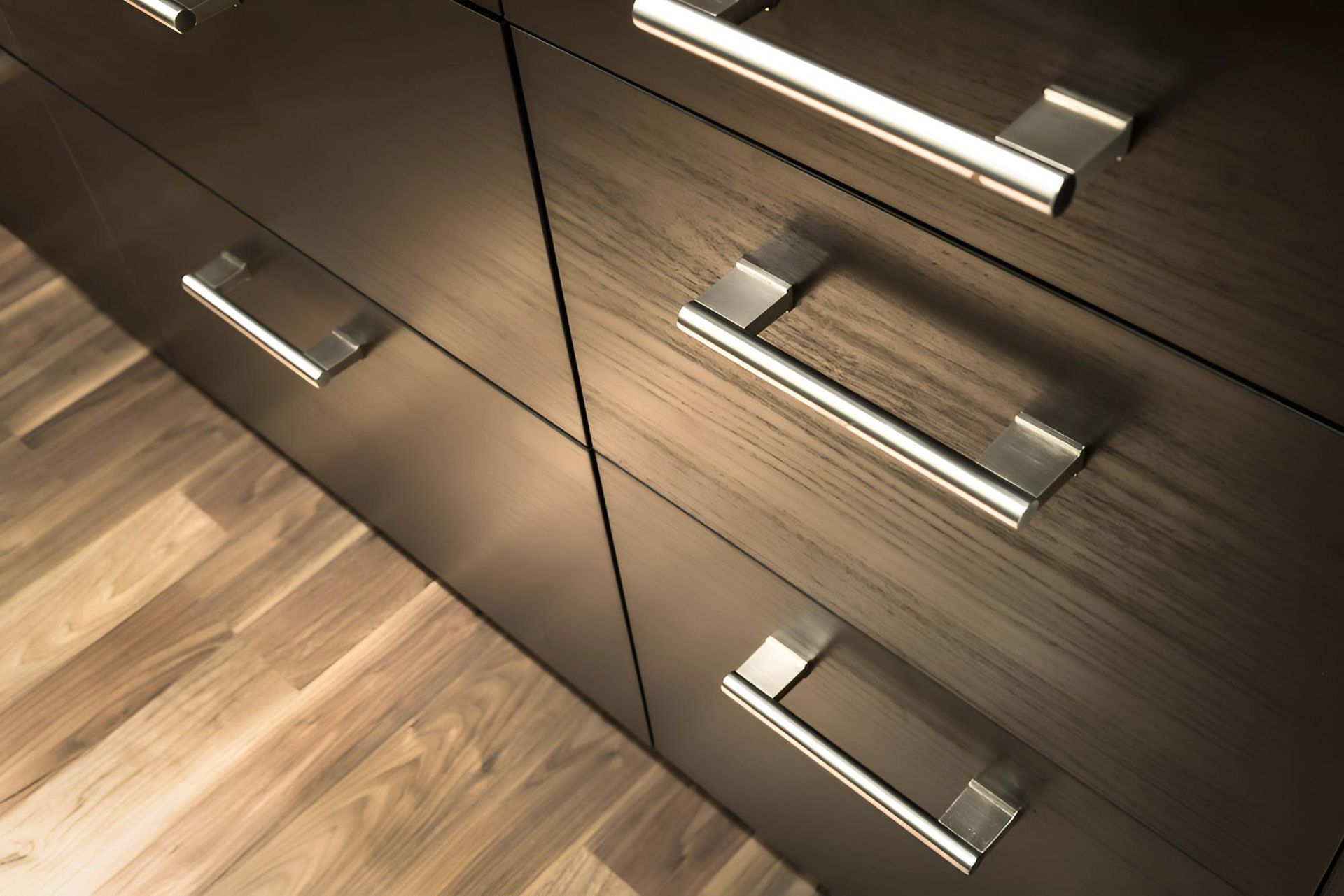 A Row of Wooden Drawers With Metal Handles — Precision Kitchens & Cabinets in Bangalow, NSW