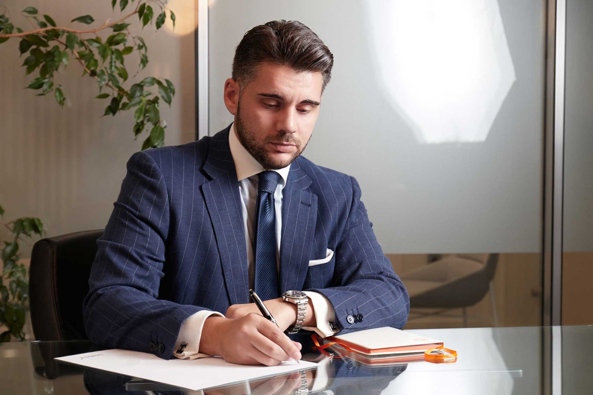 Man Signing a Document — Newport Beach, CA — Paoli & Purdy, PC