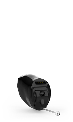 Black in-the-ear hearing aid on a white background, angled slightly. It has a receiver tube.