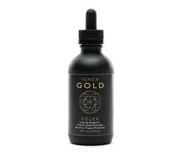 Black bottle of Ionex Gold liquid with dropper.