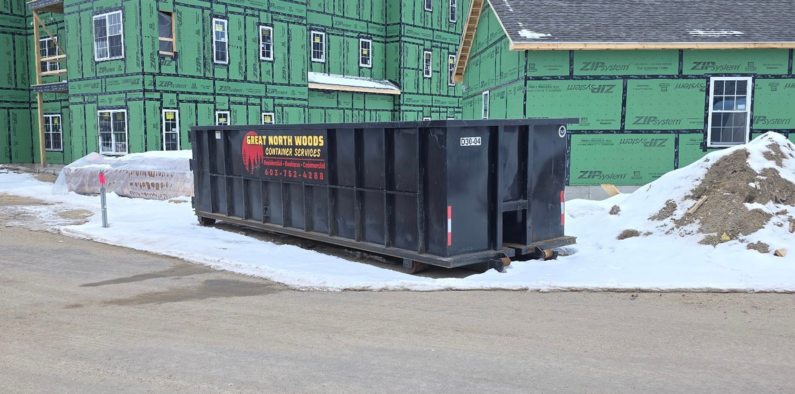 Black dumpster with