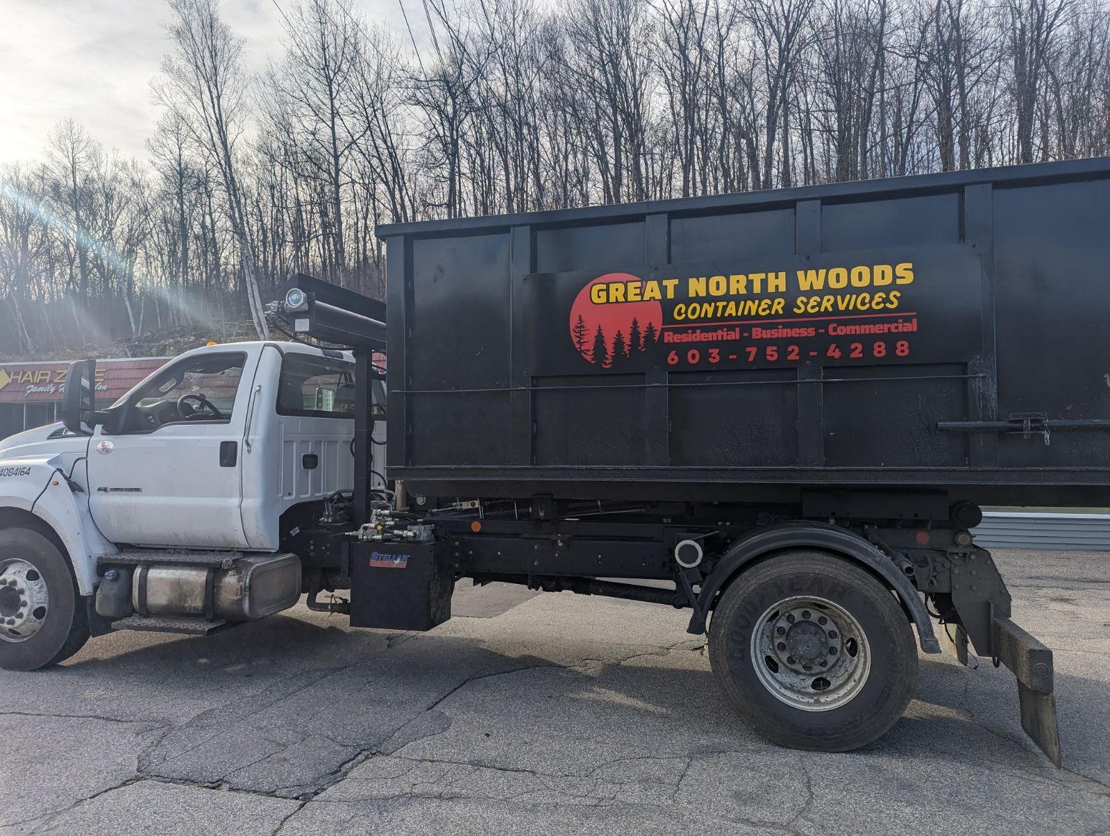 A dumpster rental company is driving out for a dumpster delivery in Conway, NH. 