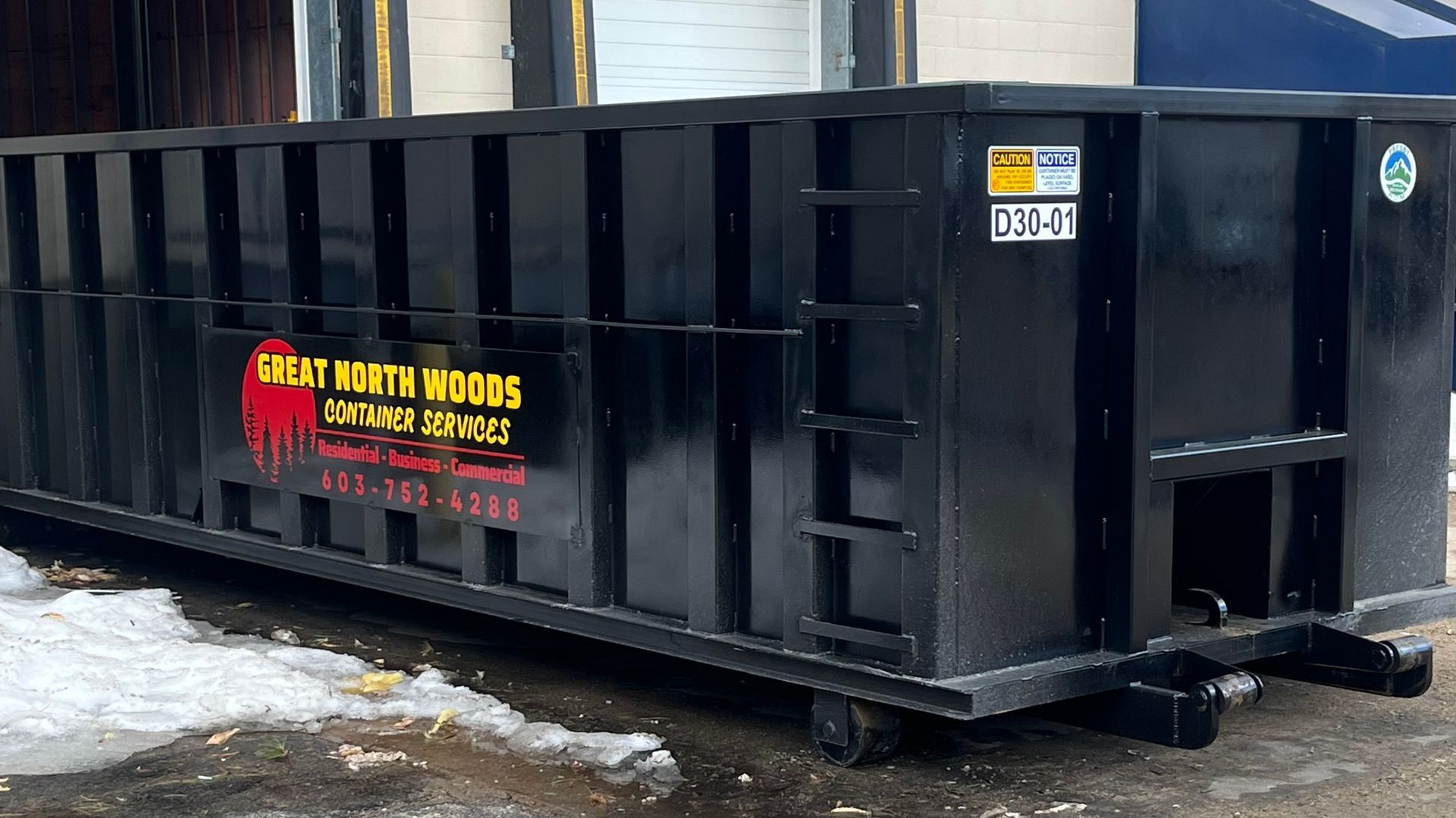 Black dumpster with 