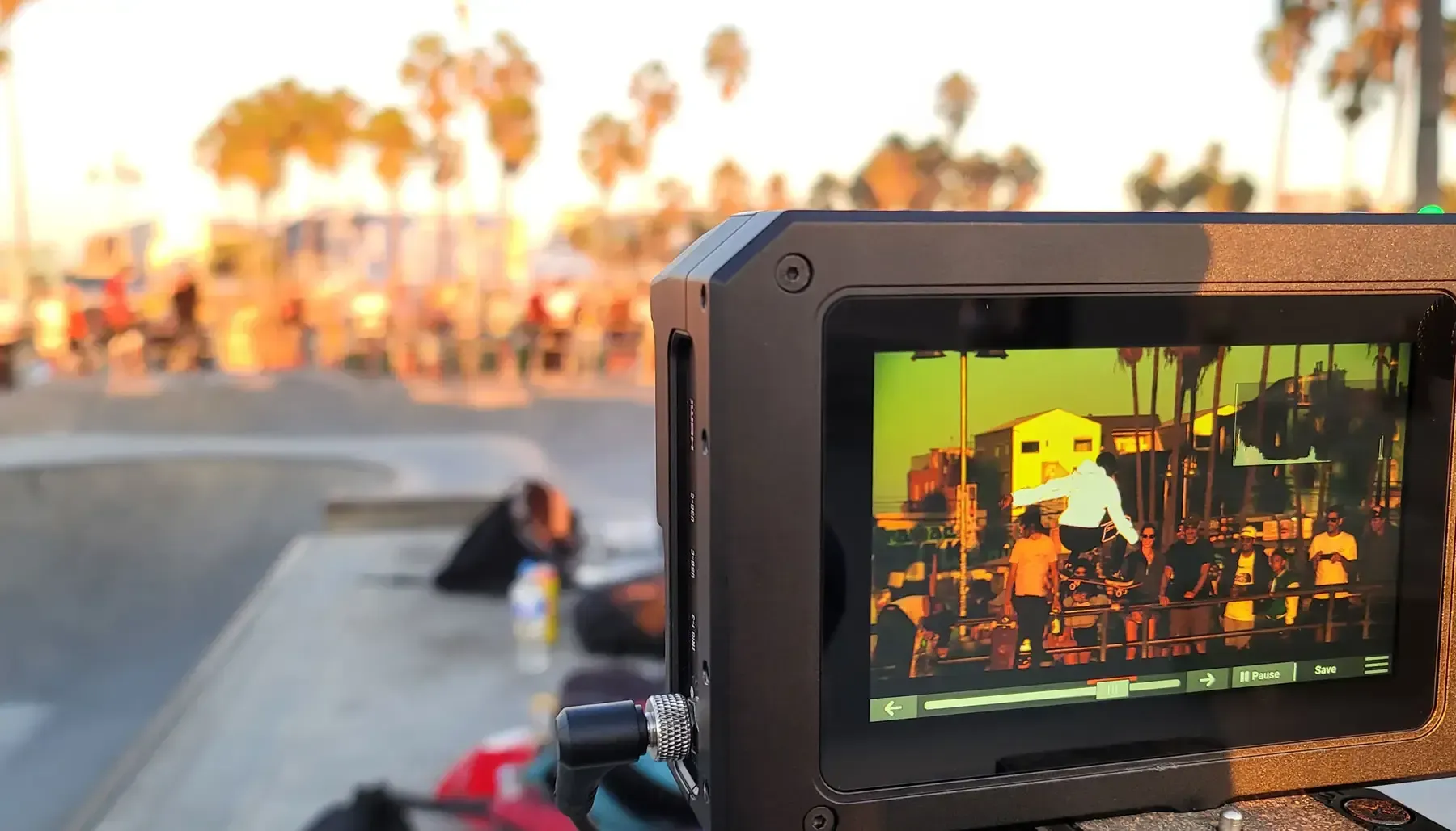 A camera is taking a picture of a skateboarder on a ramp.