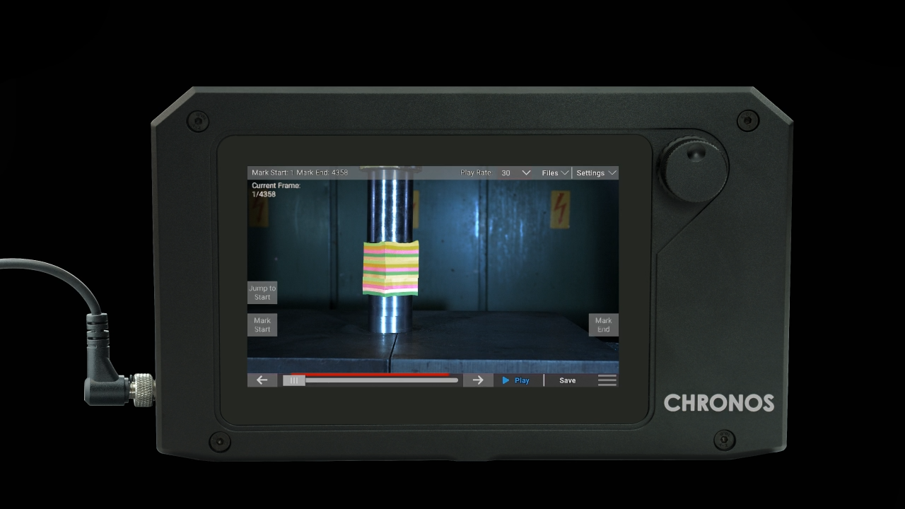 A black device with a screen that says chronos on it