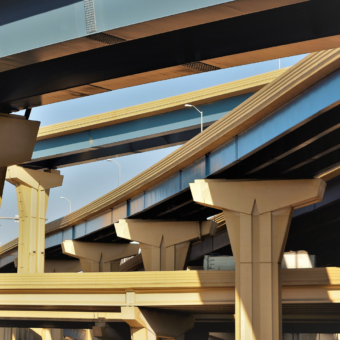 A row of highway bridges with a blue sky in the background