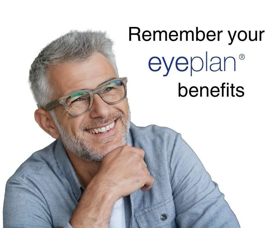 Smiling person wearing glasses, looking up, with text