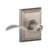 Silver door lever handle on a rectangular backplate, isolated on a white background