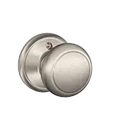 Brushed nickel round door knob and lockset on a white background