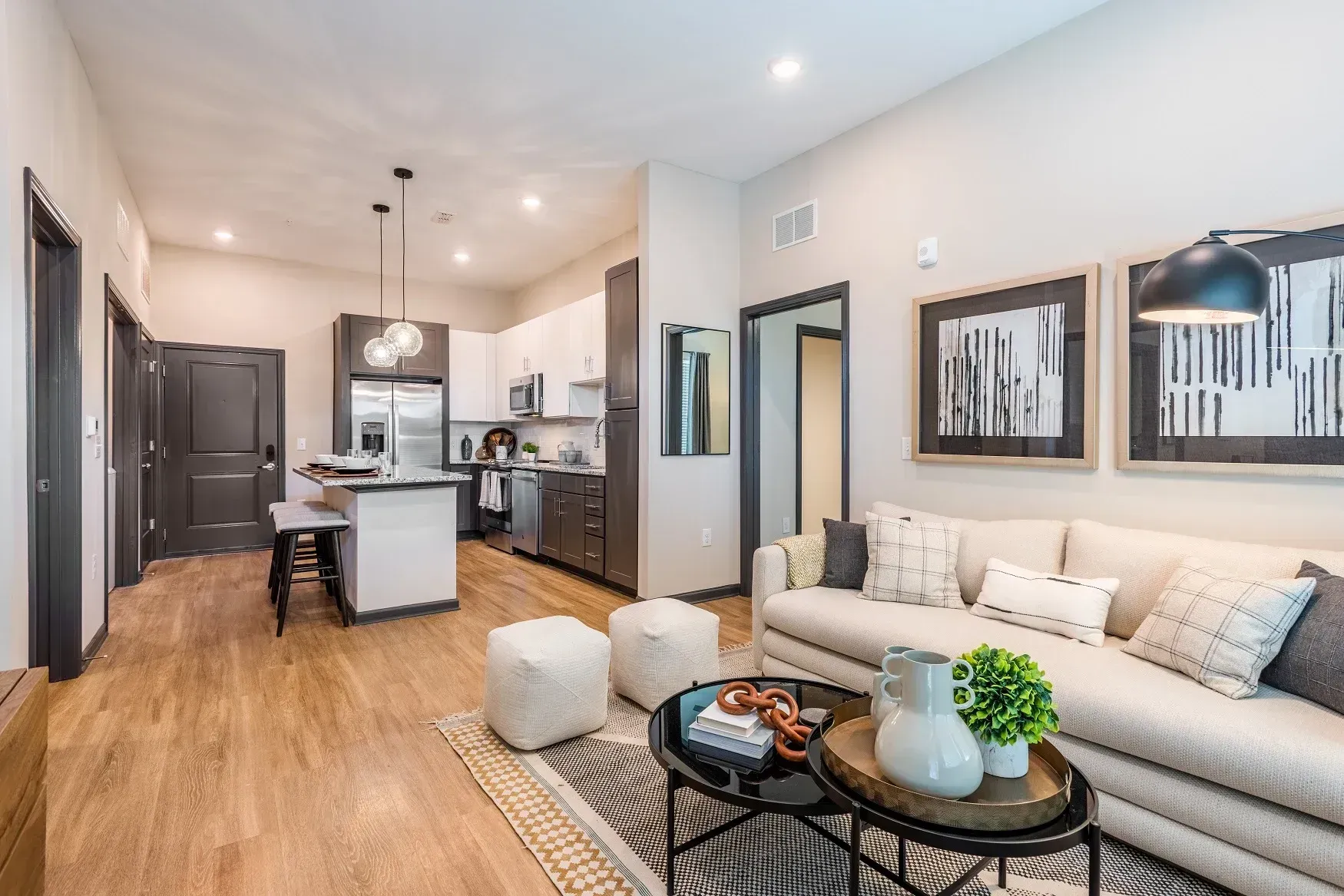 Wood-style flooring in a model home's living space at Livano Avondale.
