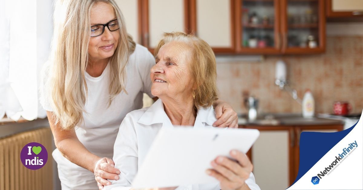 two old ladies who are disabled in the NDIS looking at each other