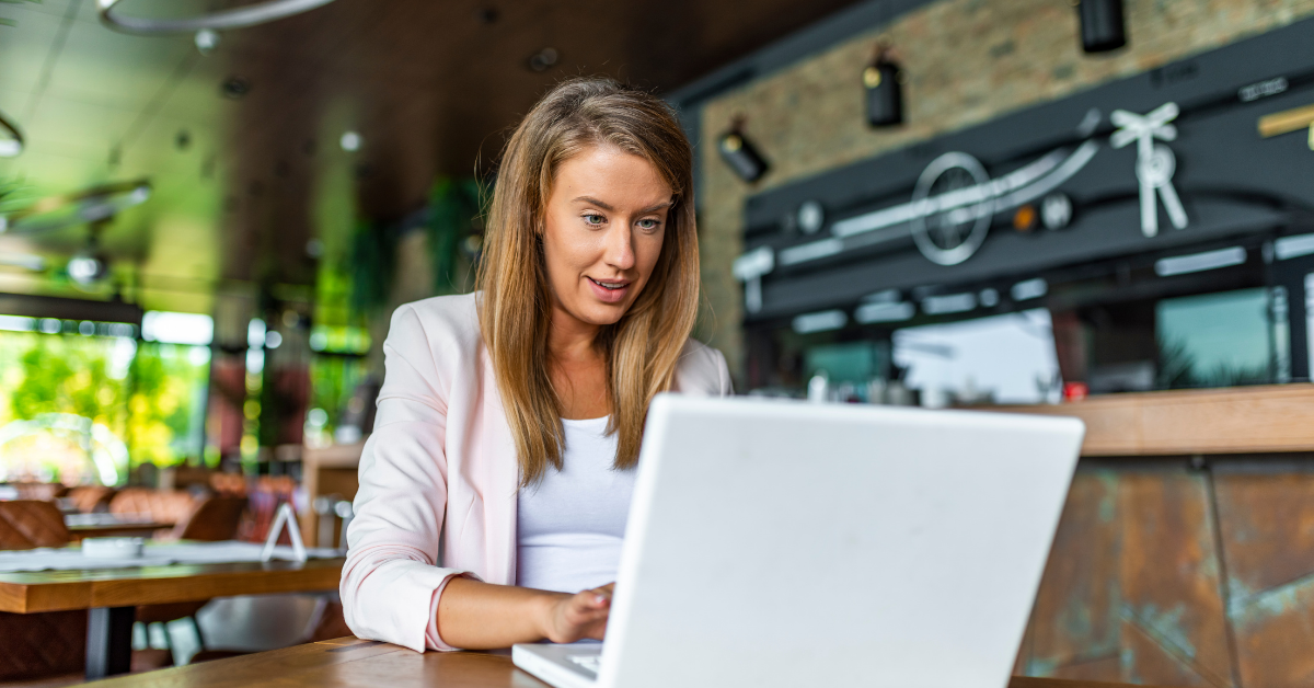 business broker lady learning on her laptop