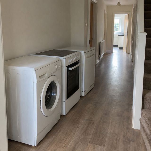 Room with the old appliance still in place, before collection
