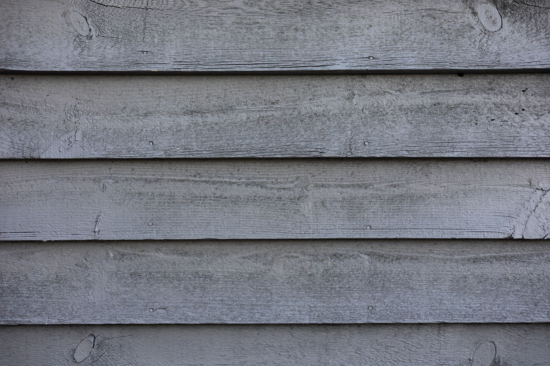 Horizontal gray wooden siding.