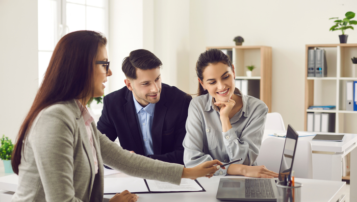 Going over property management options with a couple