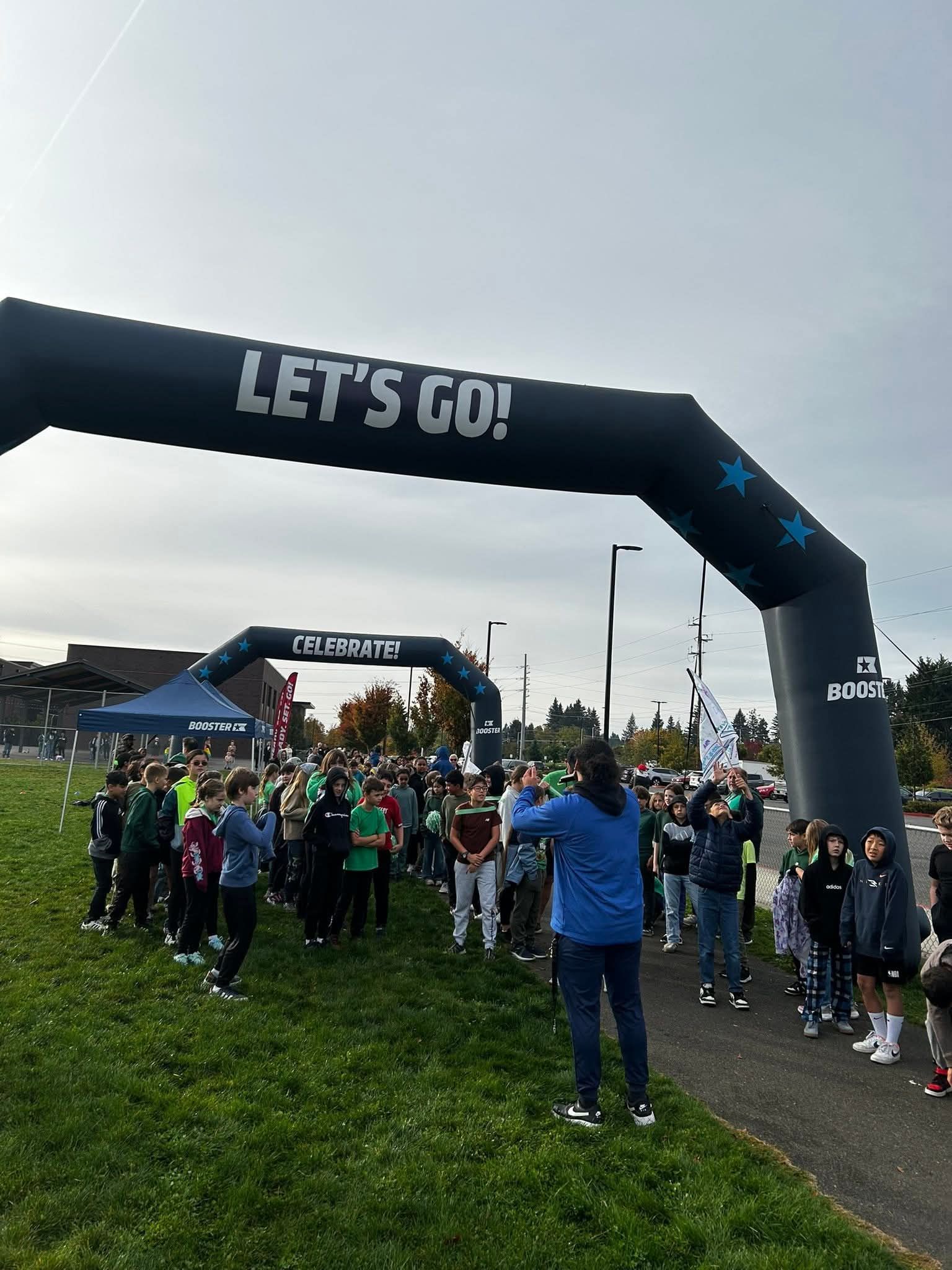 Runners gather under a
