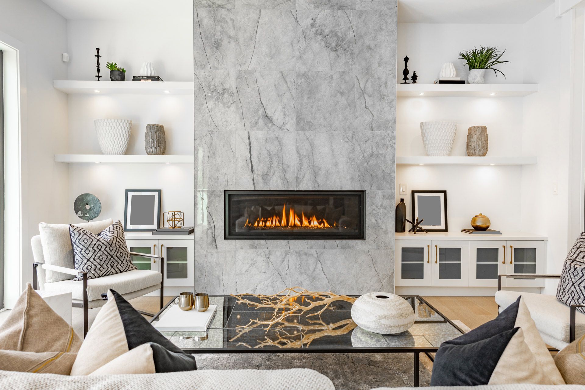 There is a fireplace in the middle of the living room.
