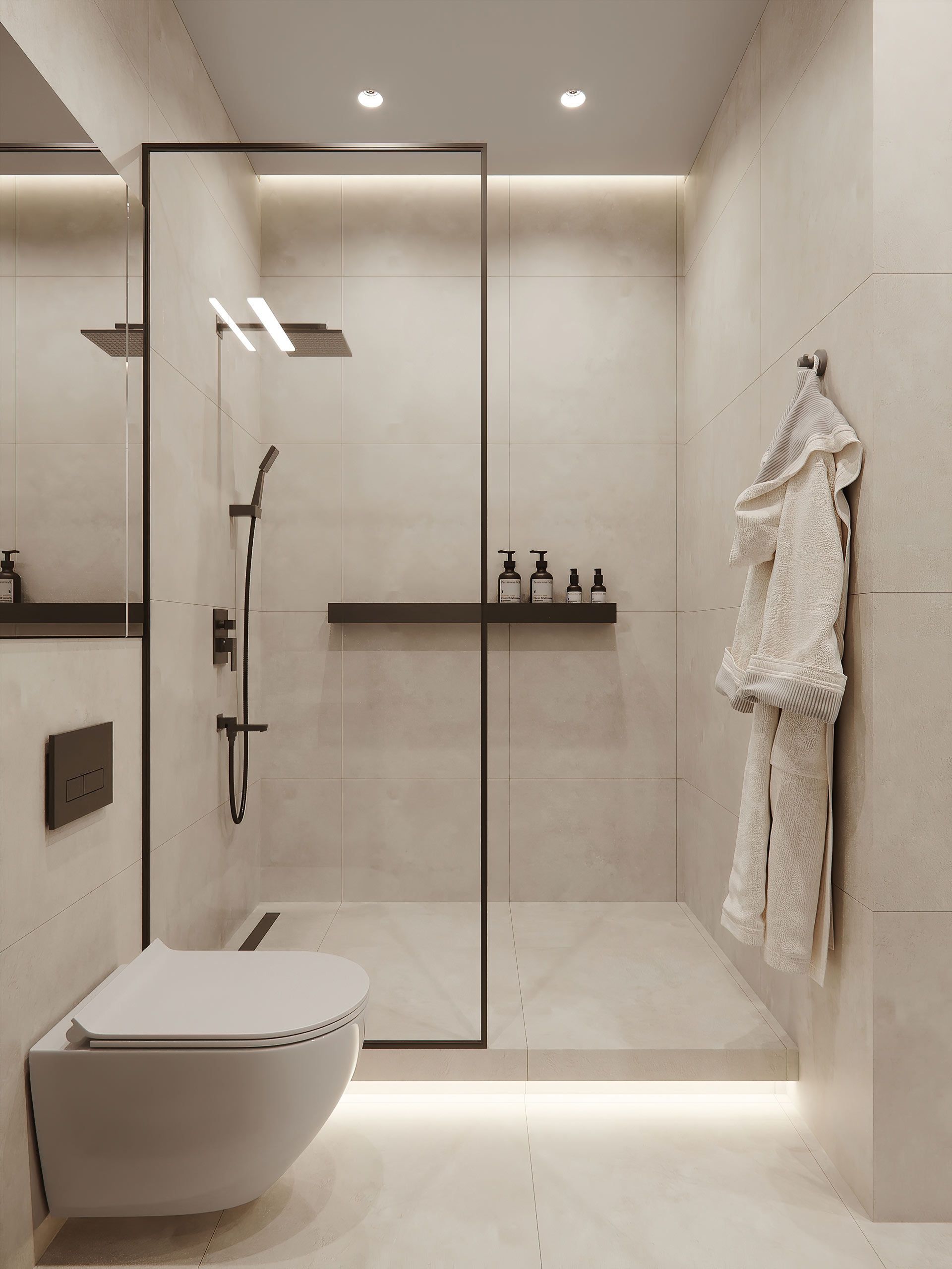 A bathroom with a toilet and a walk in shower.