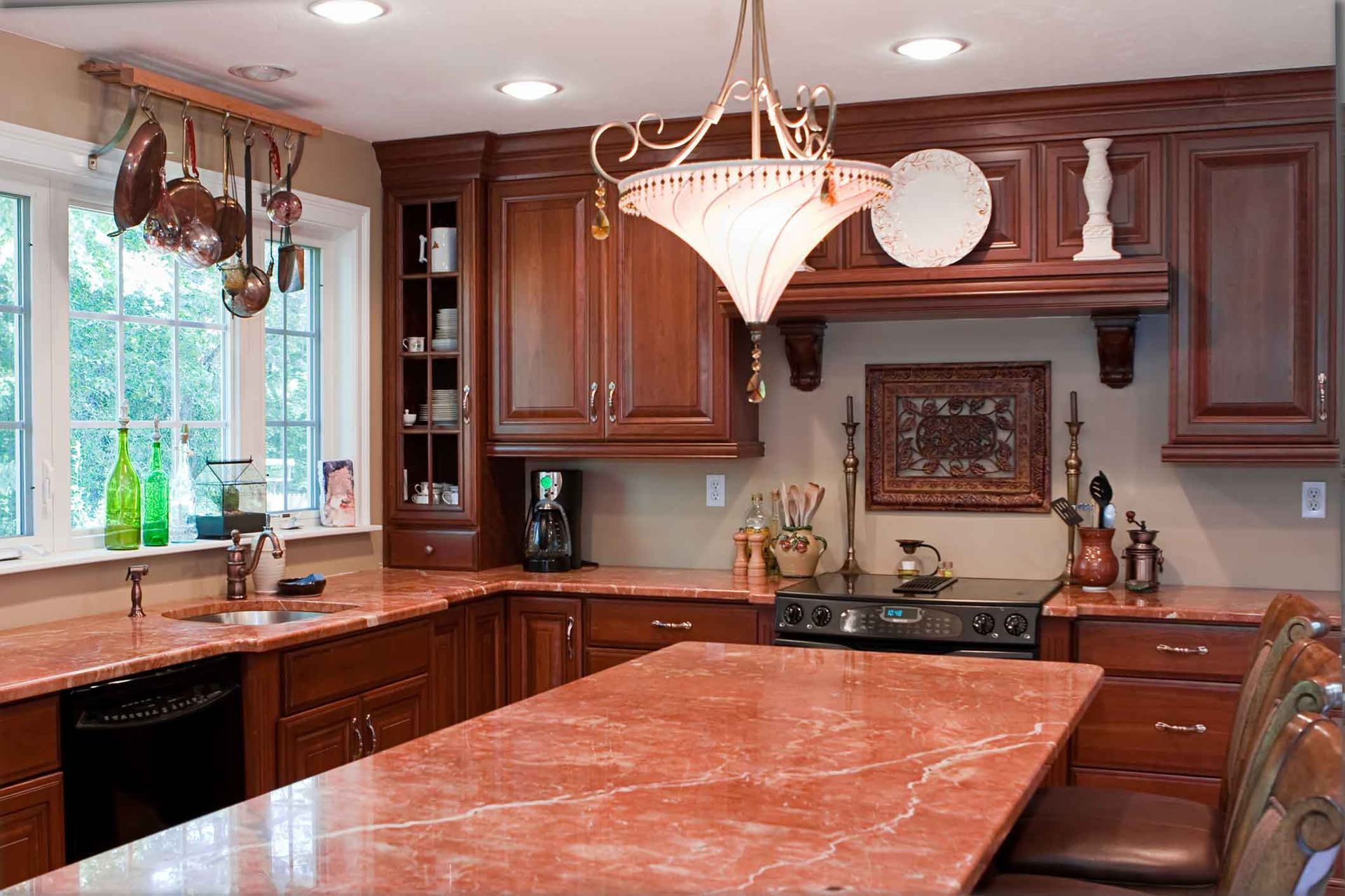 A Kitchen With Wooden Cabinets And Granite Counter Tops – Chico, CA - Steve Caperello Painting
