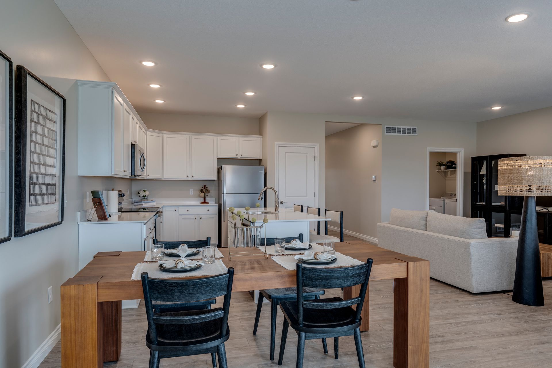 Photo of a dining table with a kitchen in the background