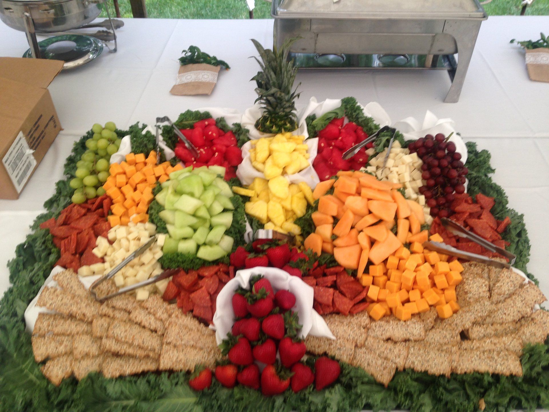 A large tray of fruits and vegetables on a table