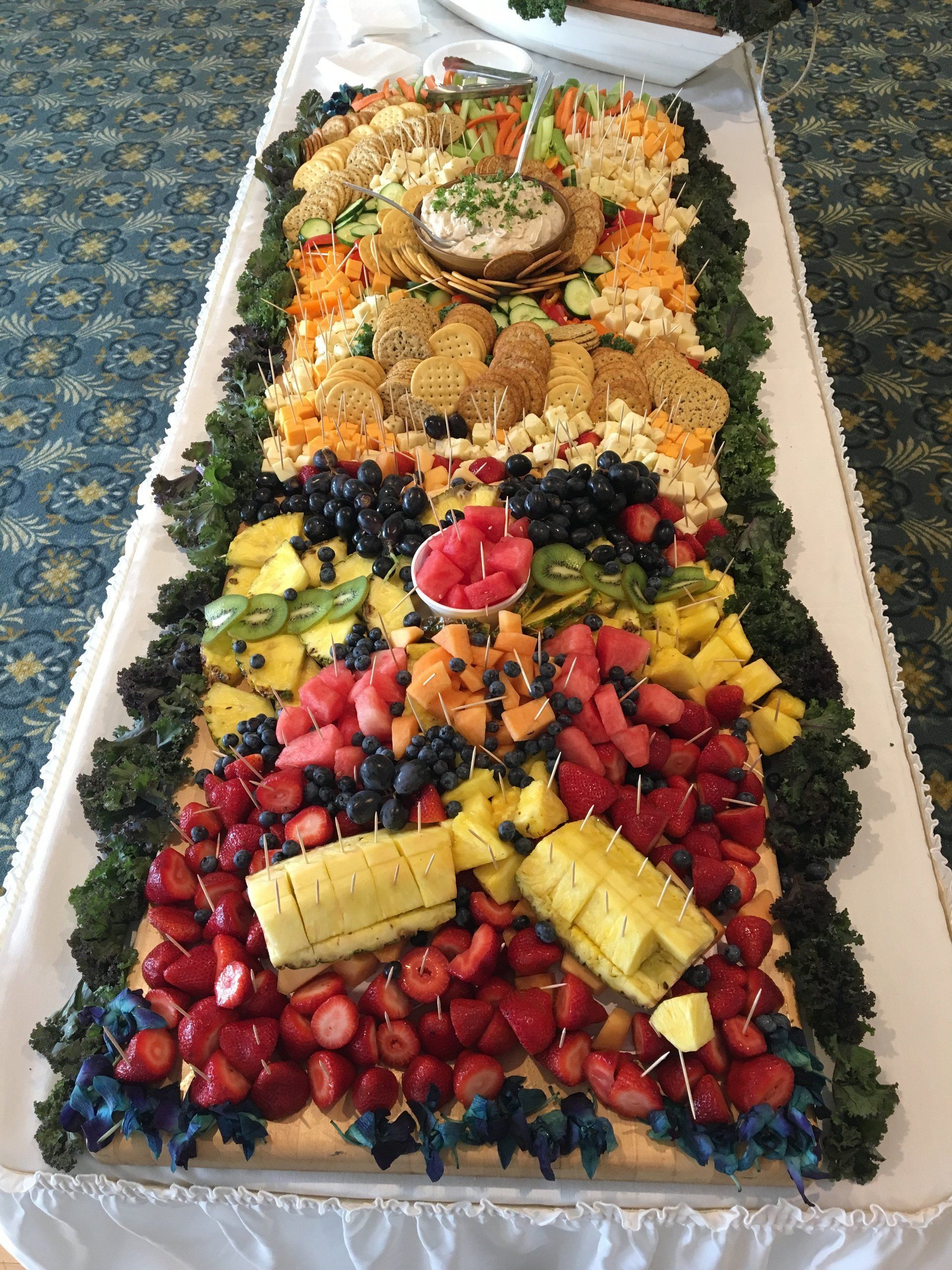 A large tray of fruit and vegetables on a table