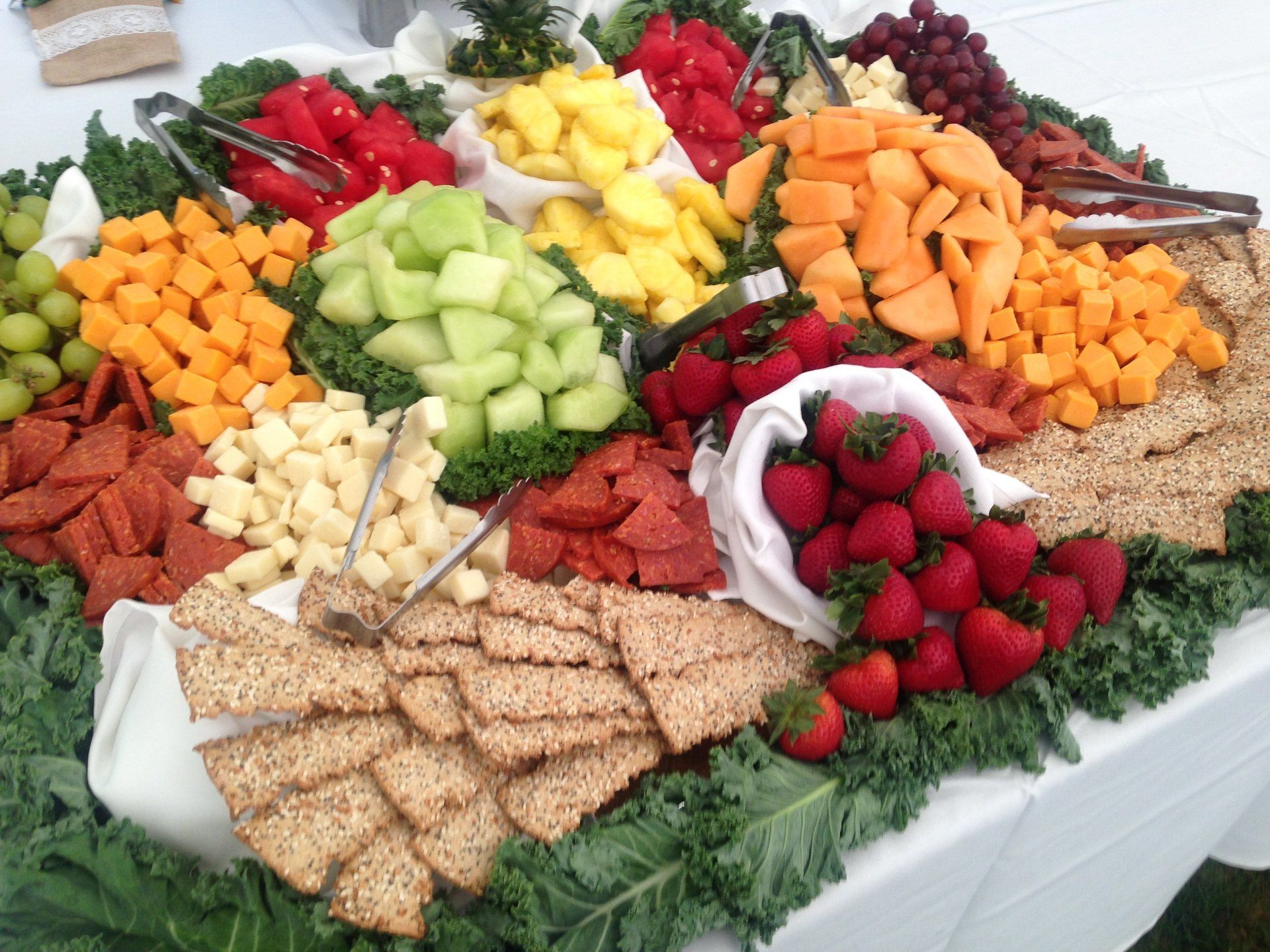 A variety of fruits and crackers on a table