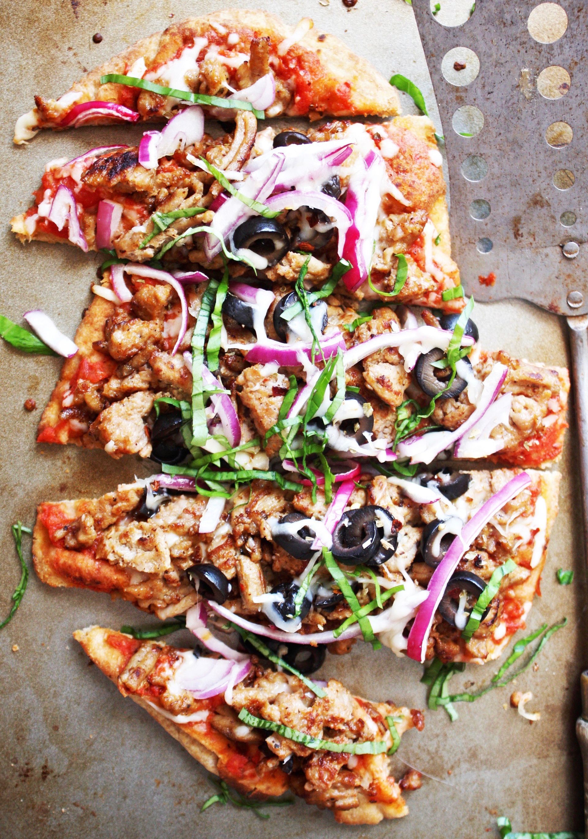 A pizza with a lot of toppings on it