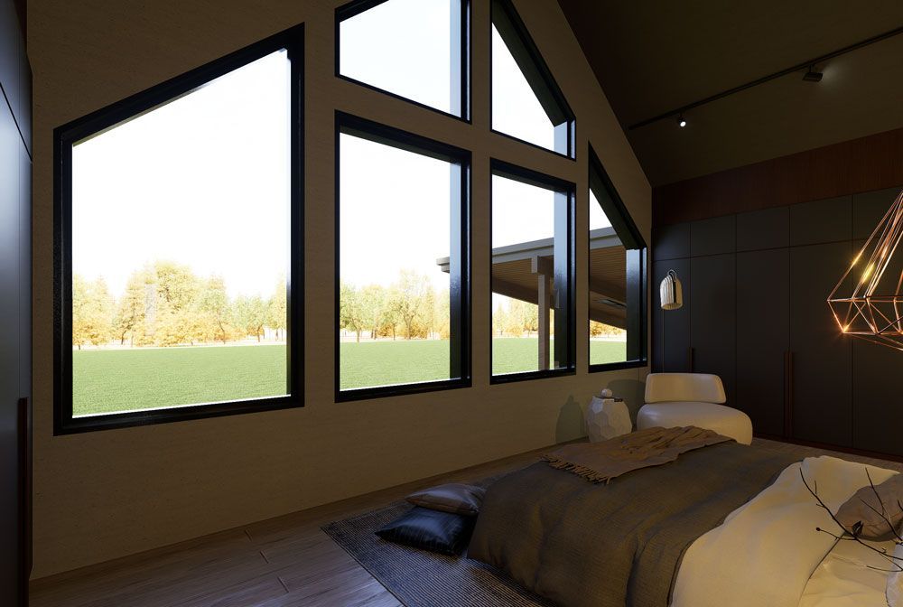 Modern bedroom with large slanted windows, a bed, and warm lighting overlooking a grassy landscape