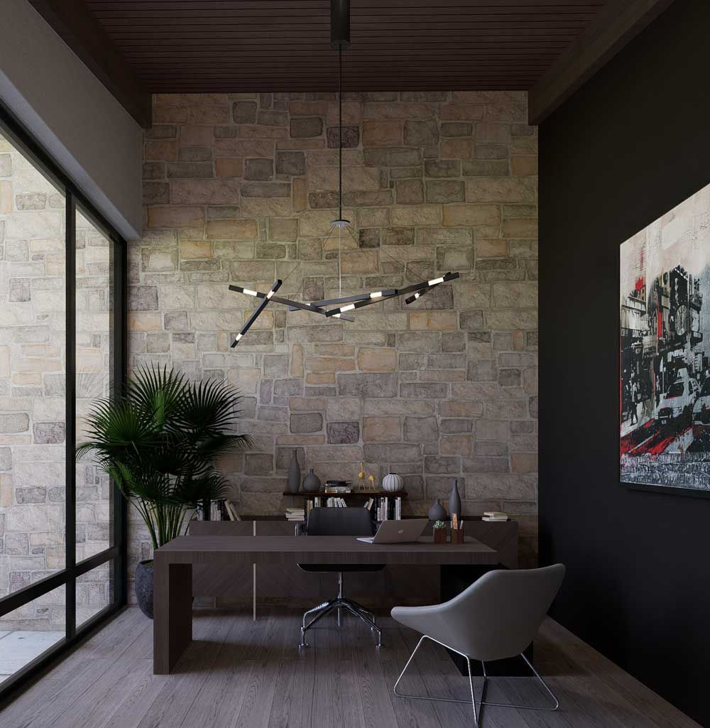 Modern home office with stone wall, dark desk, gray chair, and large sliding glass doors.