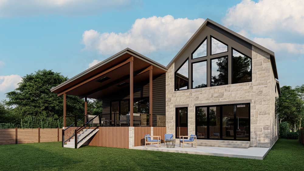 Modern stone house with large windows, a covered porch, and patio chairs in a grassy yard